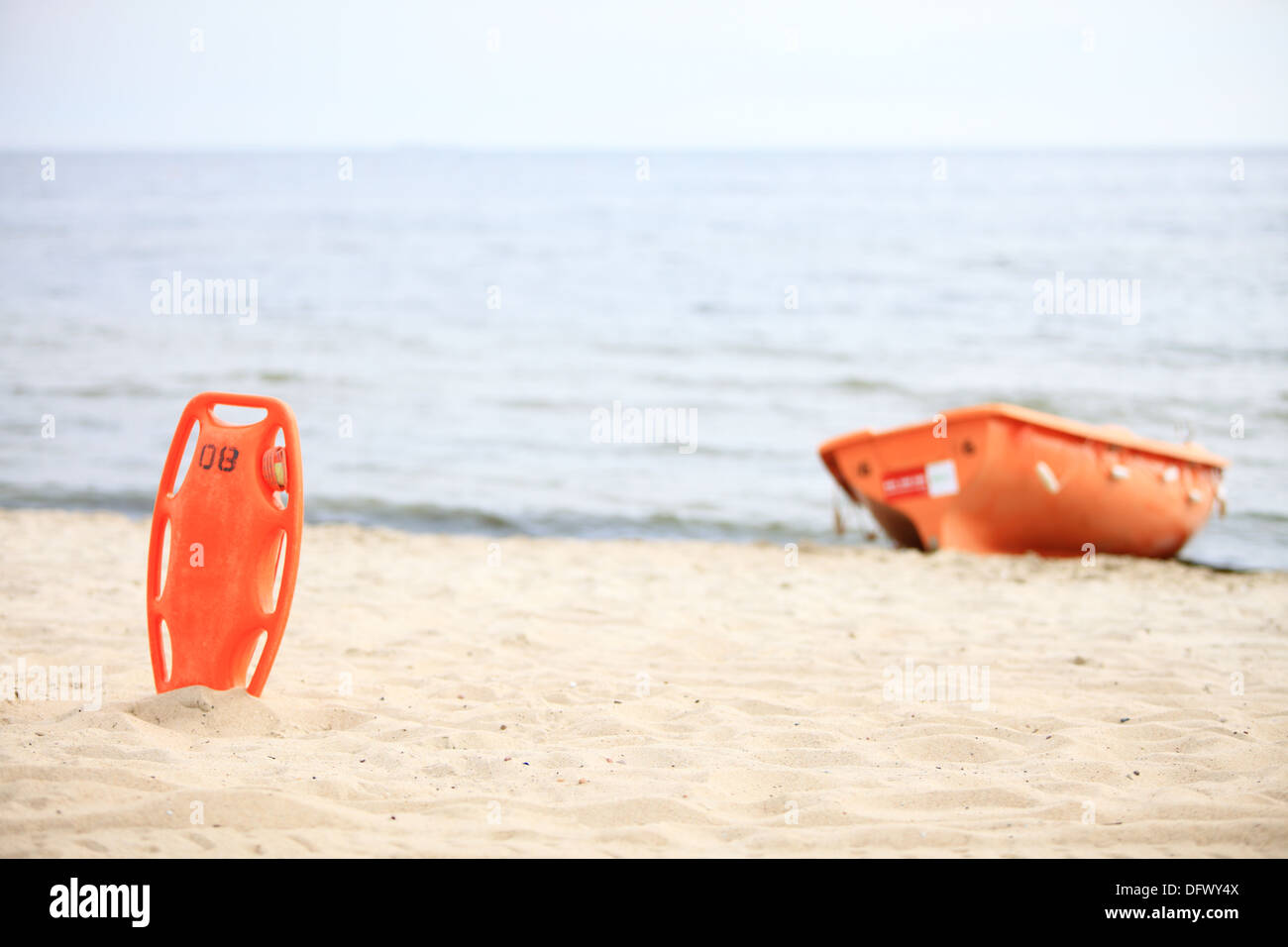 Beach life-saving. Lifeguard rescue equipment orange preserver tool and ...