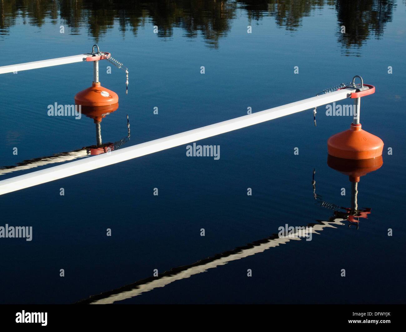 Buoys Moored in Calm Water Stock Photo