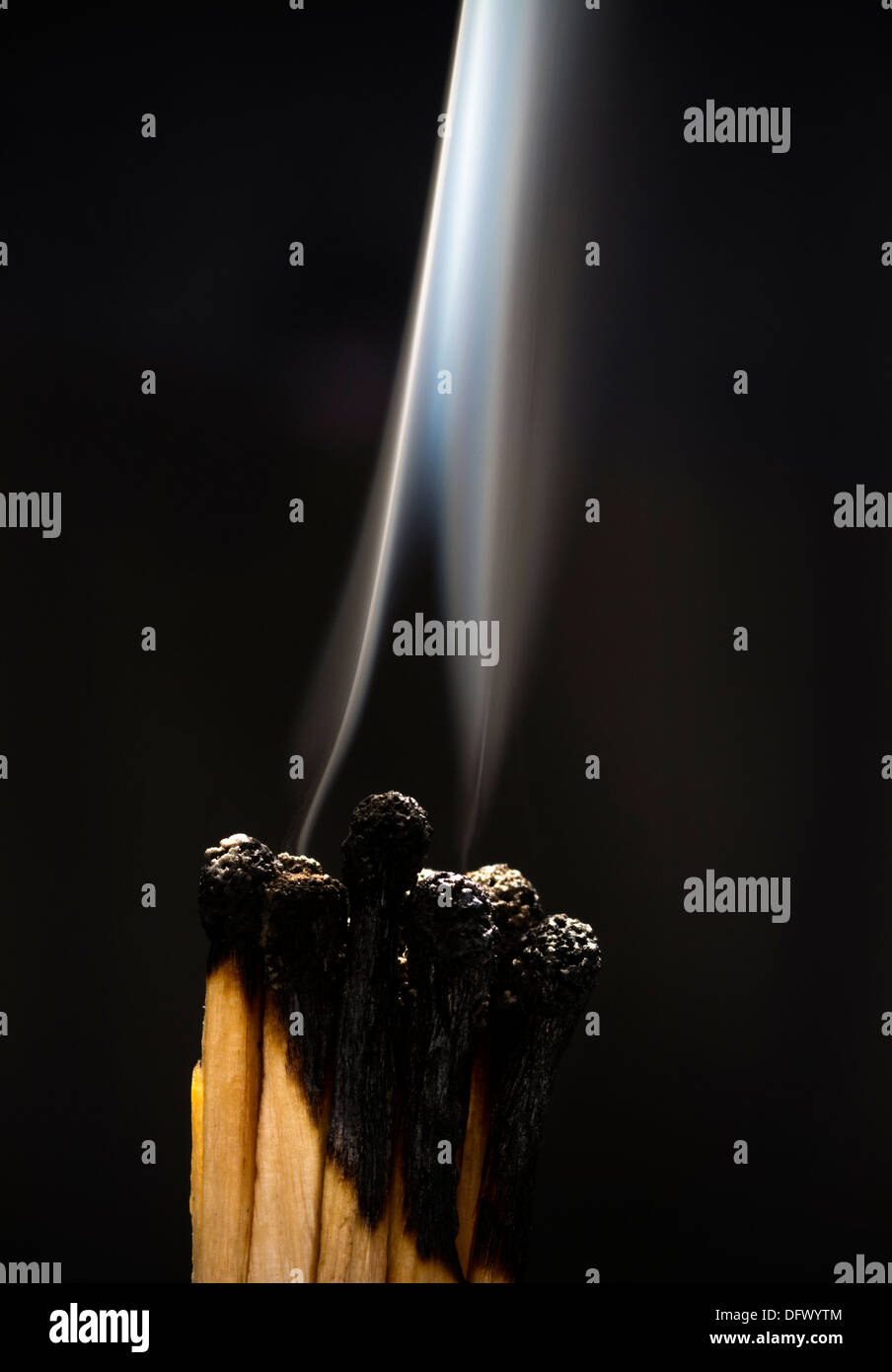 Concept photo showing burned out matches with smoke illustrating the burned out business metaphor Stock Photo