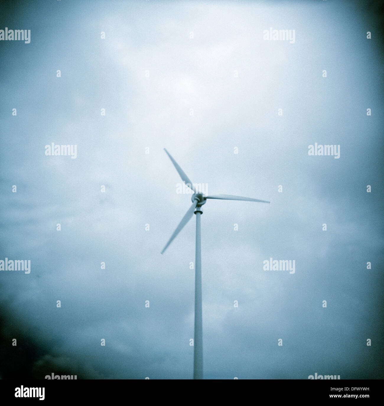 Wind Turbine Against Cloudy Sky Stock Photo - Alamy