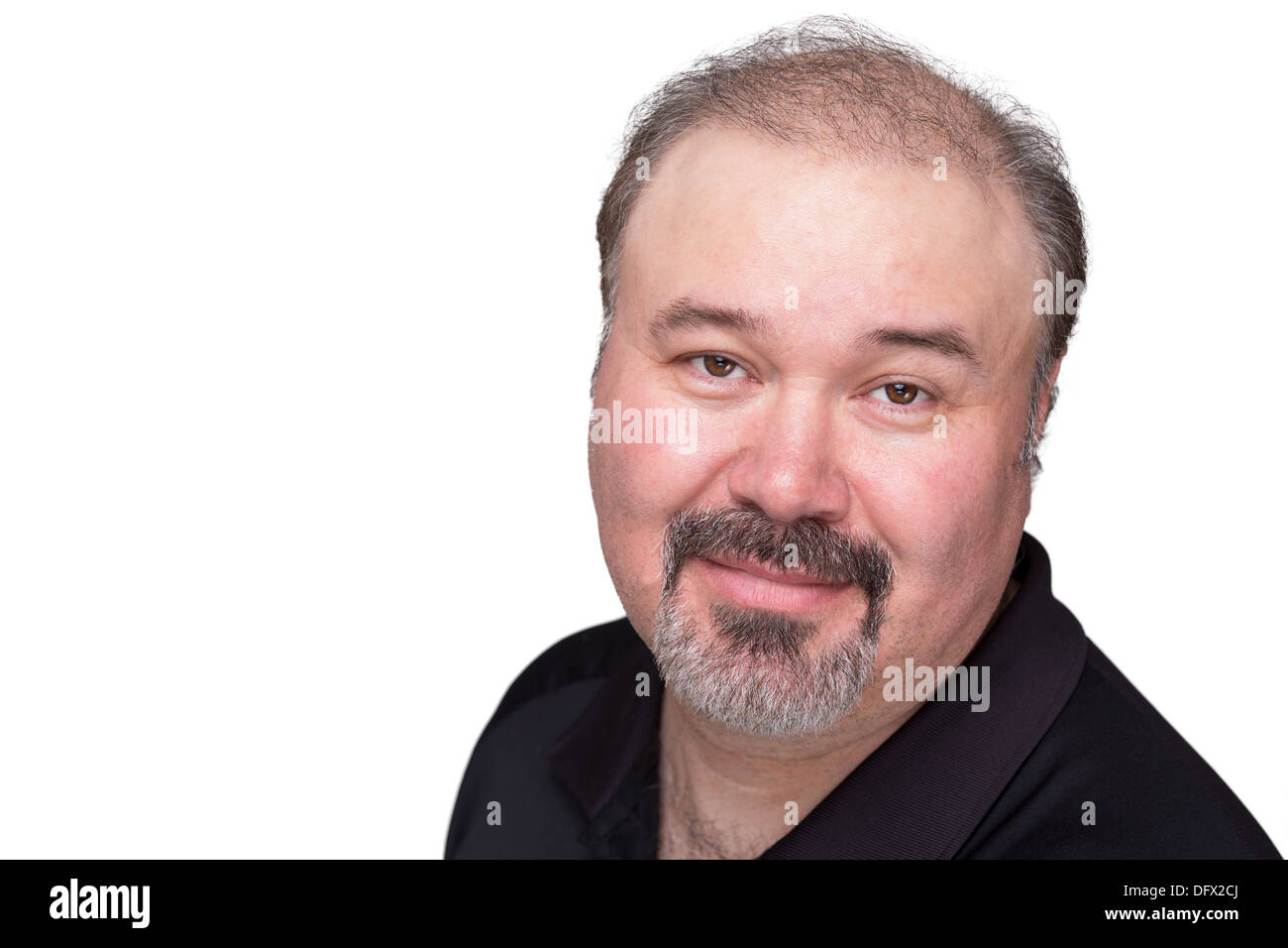 Middle aged man with his goatee looking at camera trustfully and satisfied Stock Photo