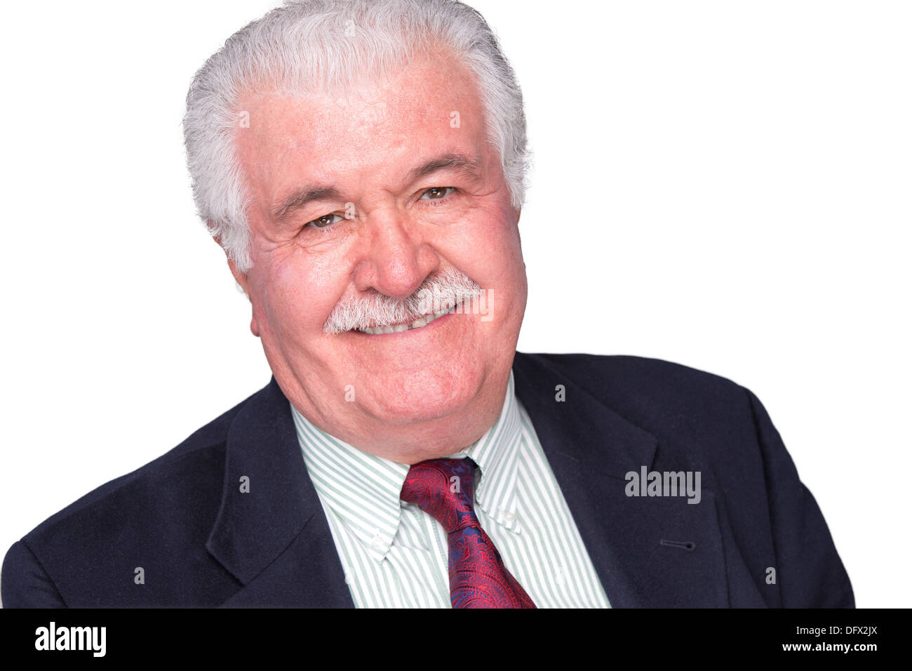 Senior white hair man with a red tie and dark blue suite smiling trustfully Stock Photo