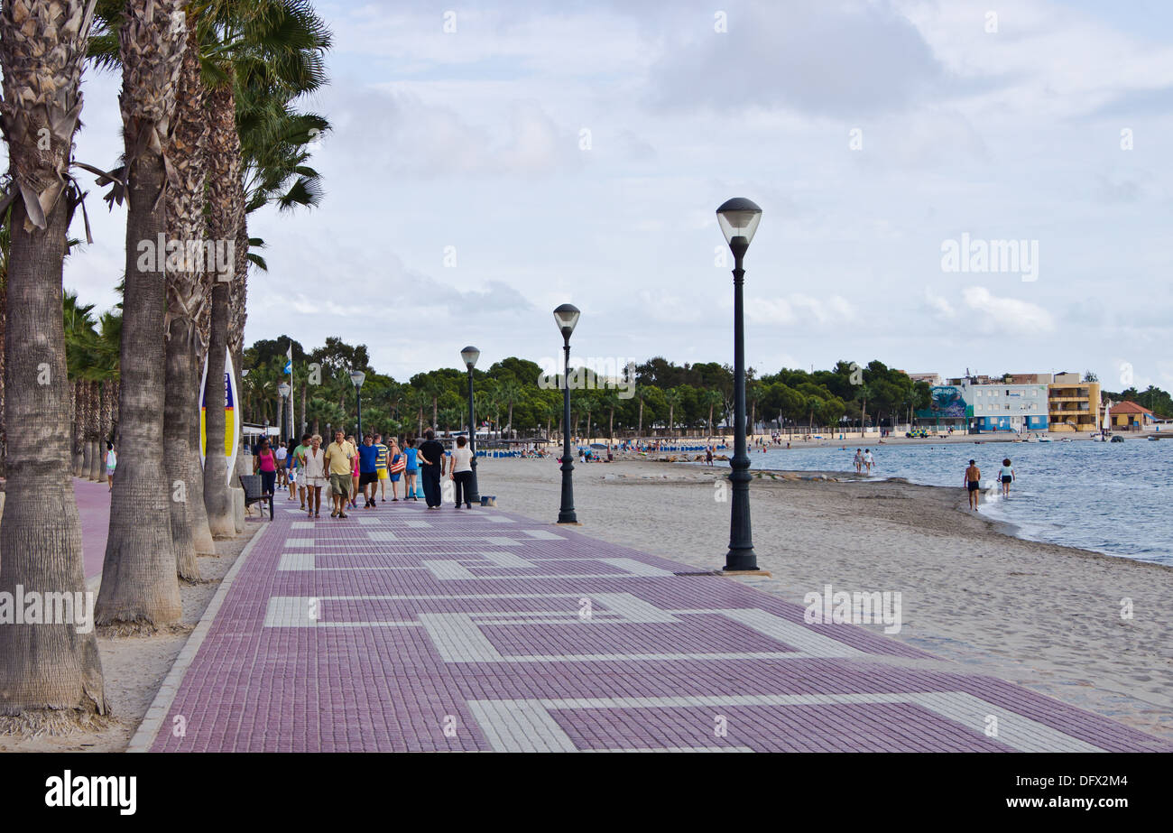 Tourists and locals walk along the promenade los Alcazares Murcia Spain Stock Photo