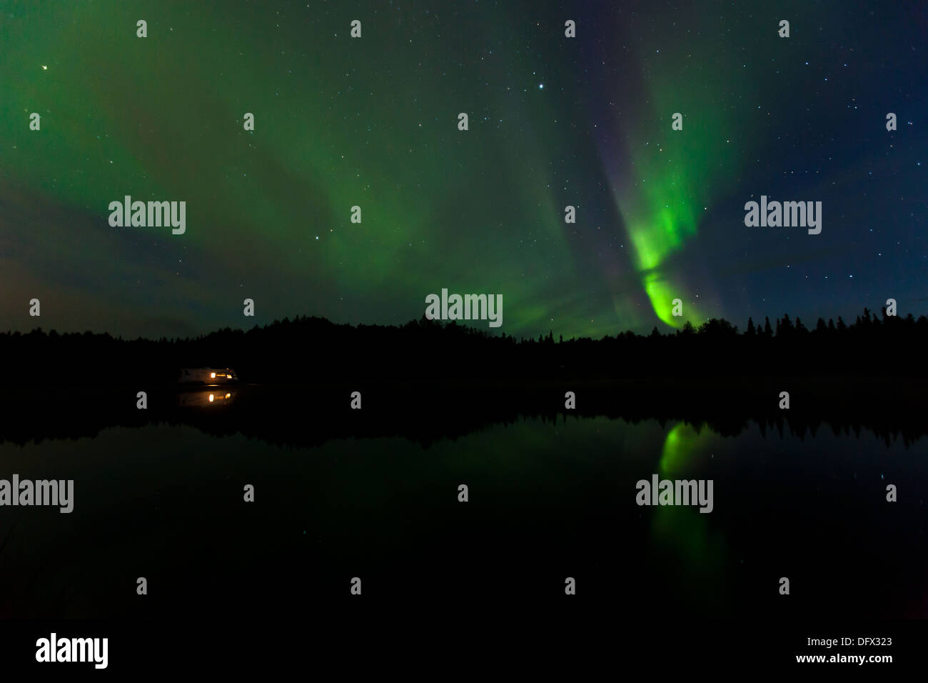 Vivid Northern Lights reflection over Olnes pond in Fairbanks, Alaska ...