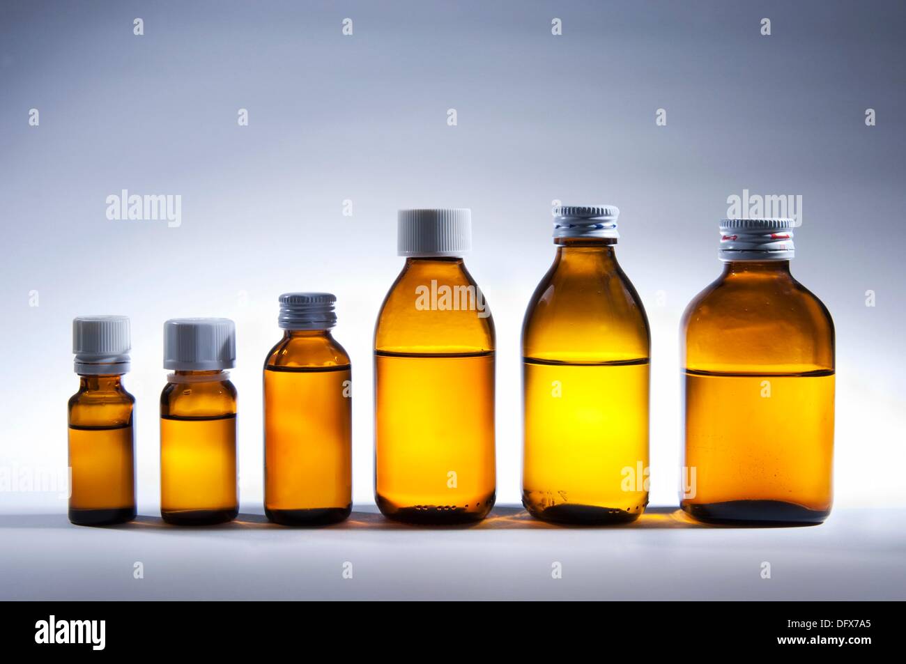 Clear bottles with liquid drugs Stock Photo Alamy