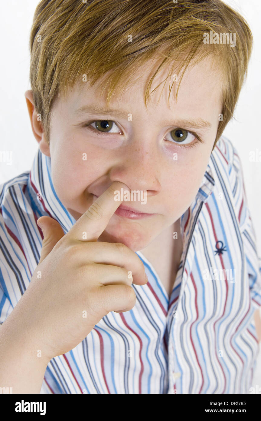 a child who puts his fingers in the nose Stock Photo Alamy