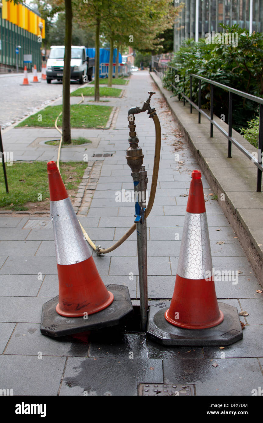 Water stand pipe in a street, Coventry city centre, UK Stock Photo