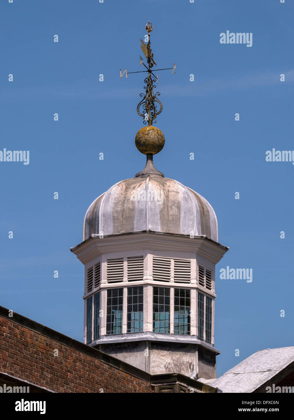 Octagonal cupola with leaded domed roof and ornate weather vane, Calke Abbey Stable block, Ticknall, Derbyshire, England, UK Stock Photo