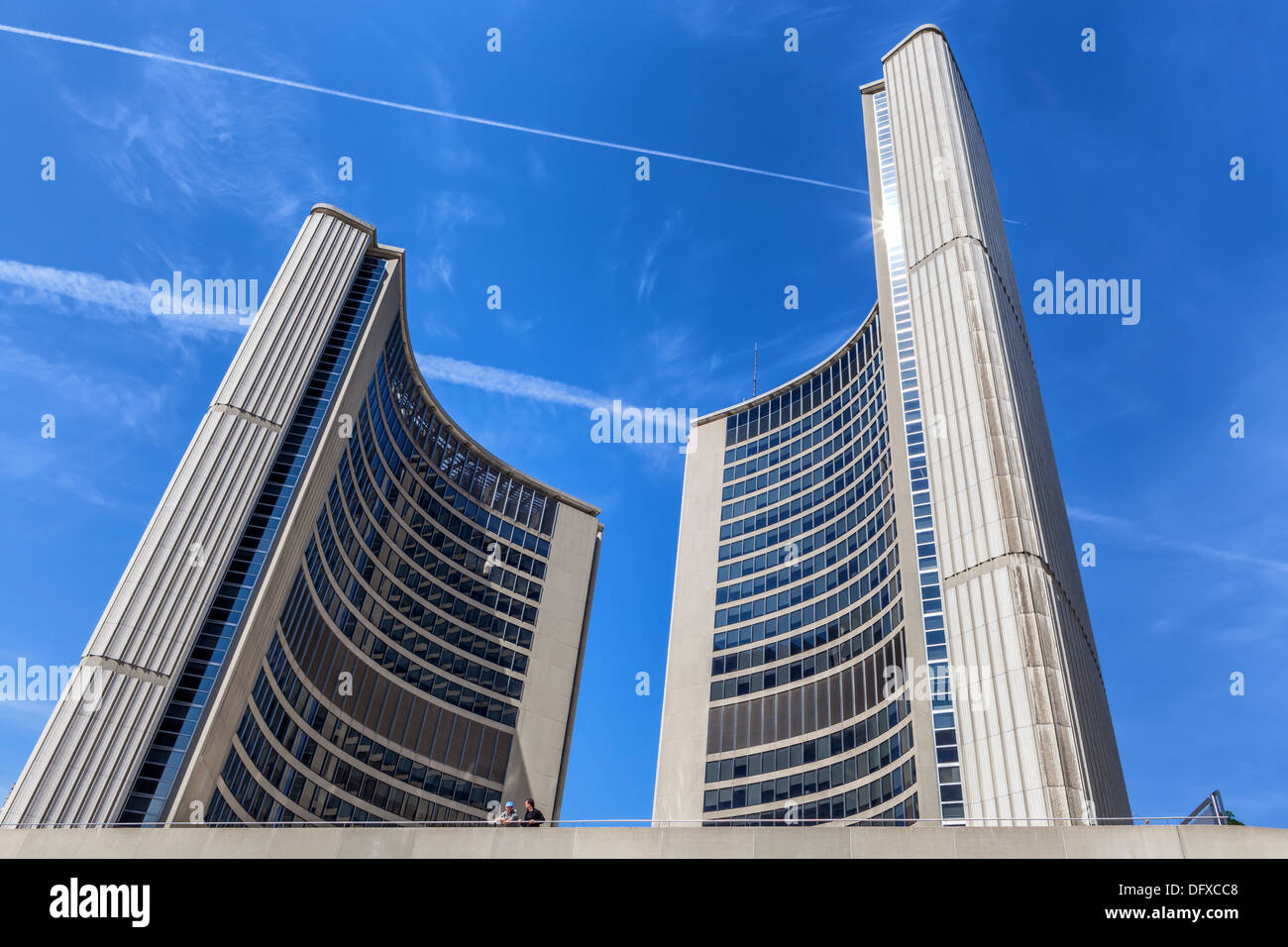 Modern curved stone buildings of the new City Hall against a blue sky in Nathan Phillips Square, 100 Queen ST, West, Toronto Stock Photo