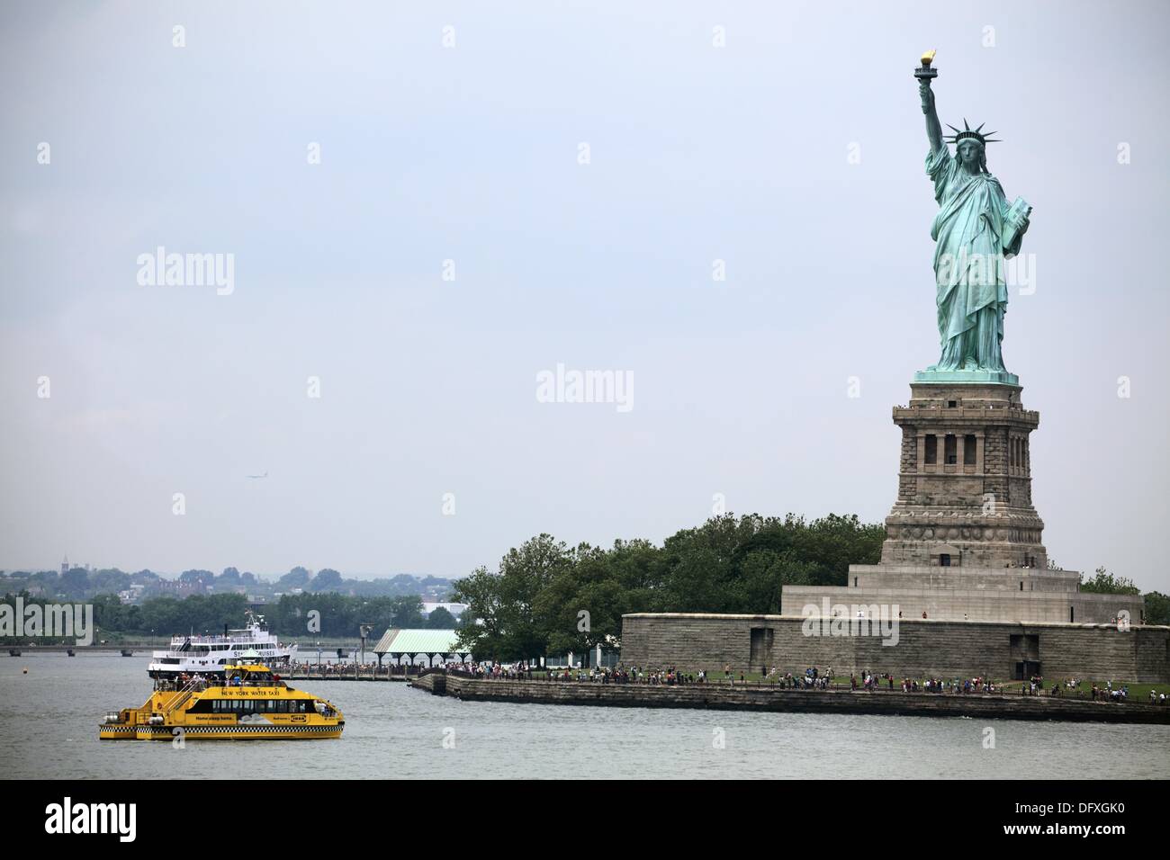 Ferry boat in the water with Statue of Liberty in the background