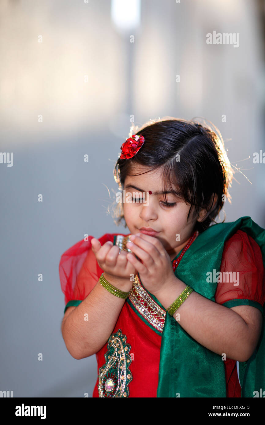 Portrait with selective focus of an indian american girl playing outdoors Stock Photo
