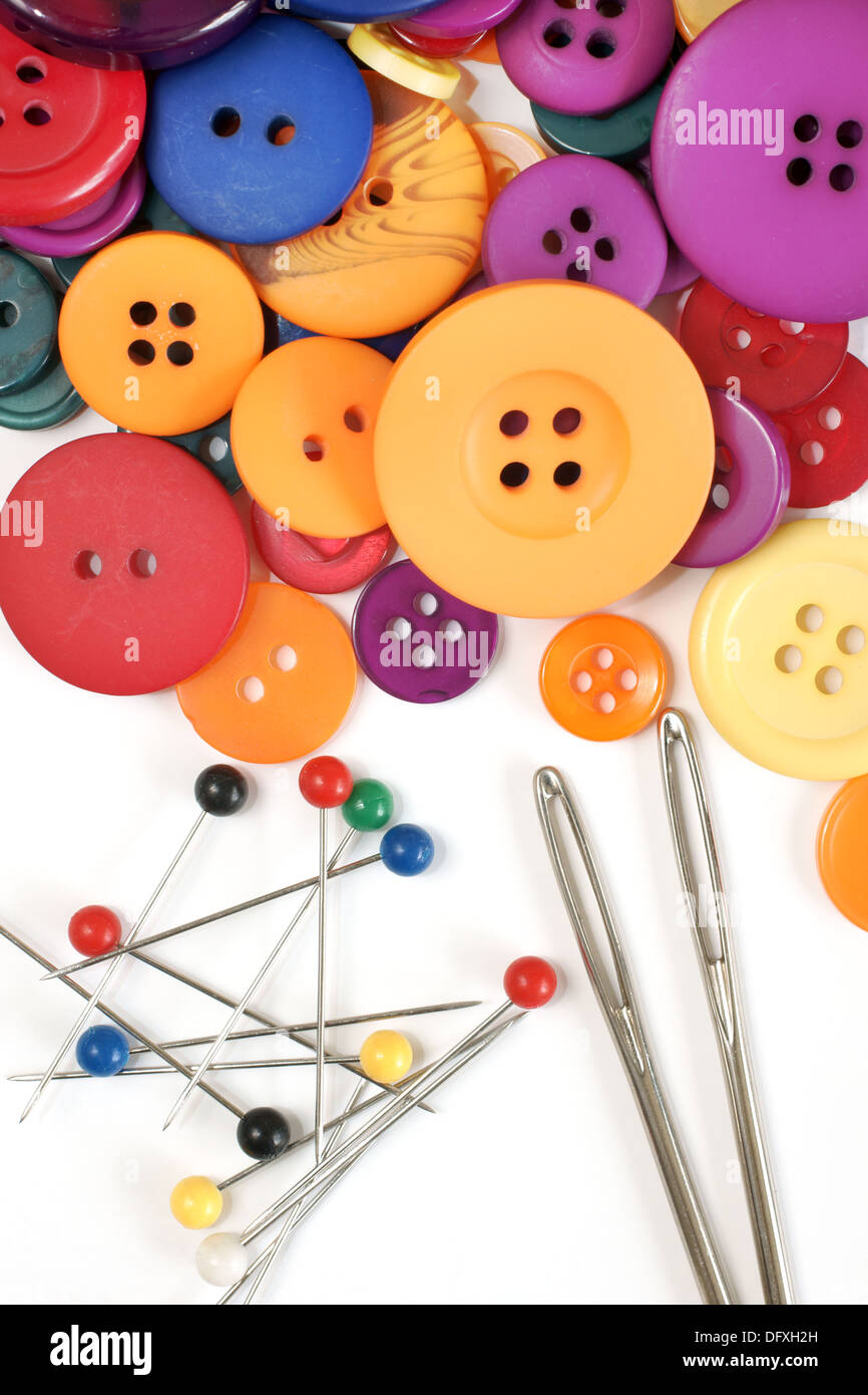 Needles and pins with colorful buttons Stock Photo - Alamy