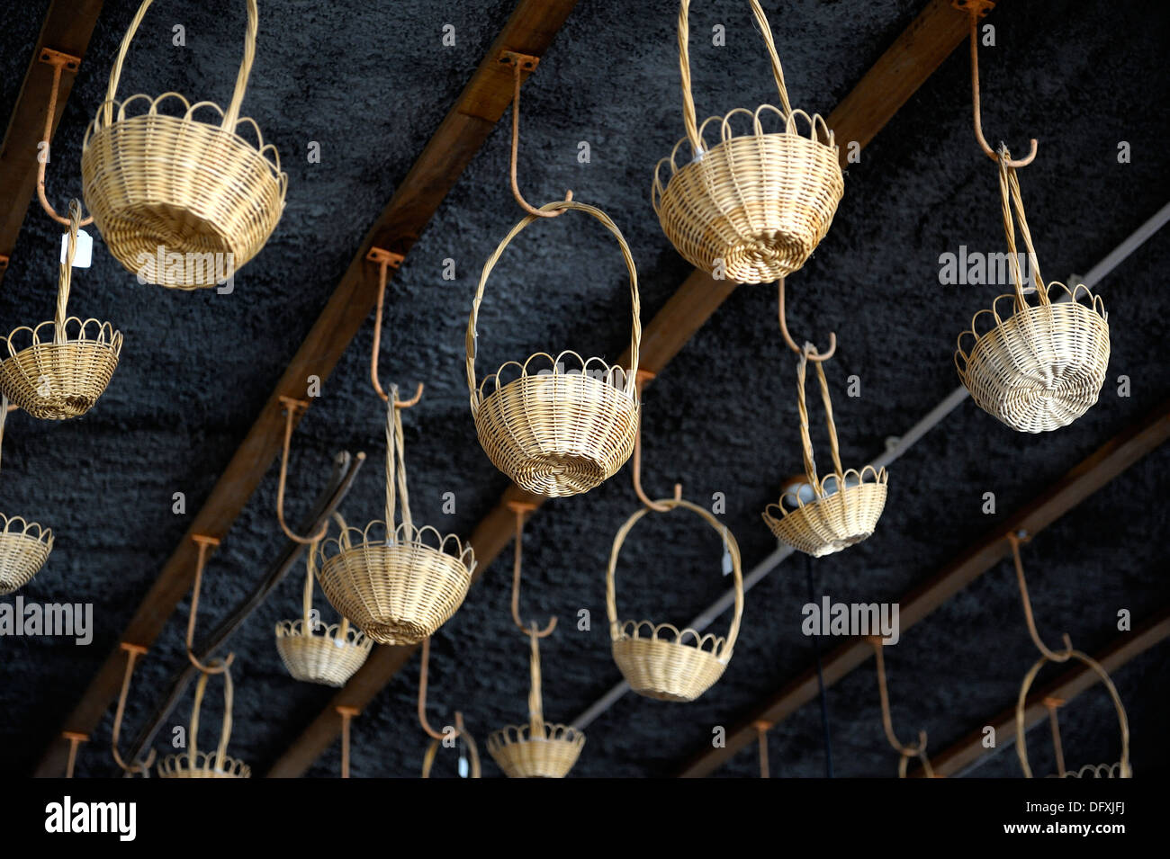 Small wicker basket hanging from a factory shop ceiling Camacha Madeira