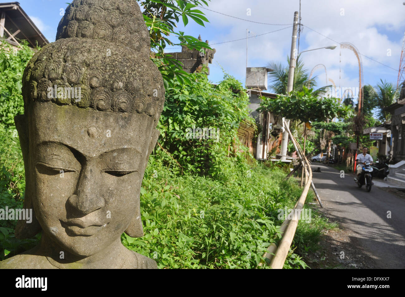 Ubud (Bali, Indonesia) a Buddha´s statue along a street Stock Photo