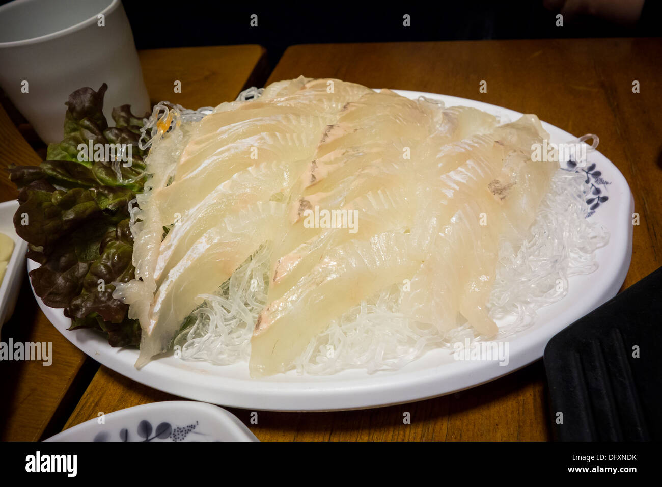 Sliced raw fish on a plate Stock Photo