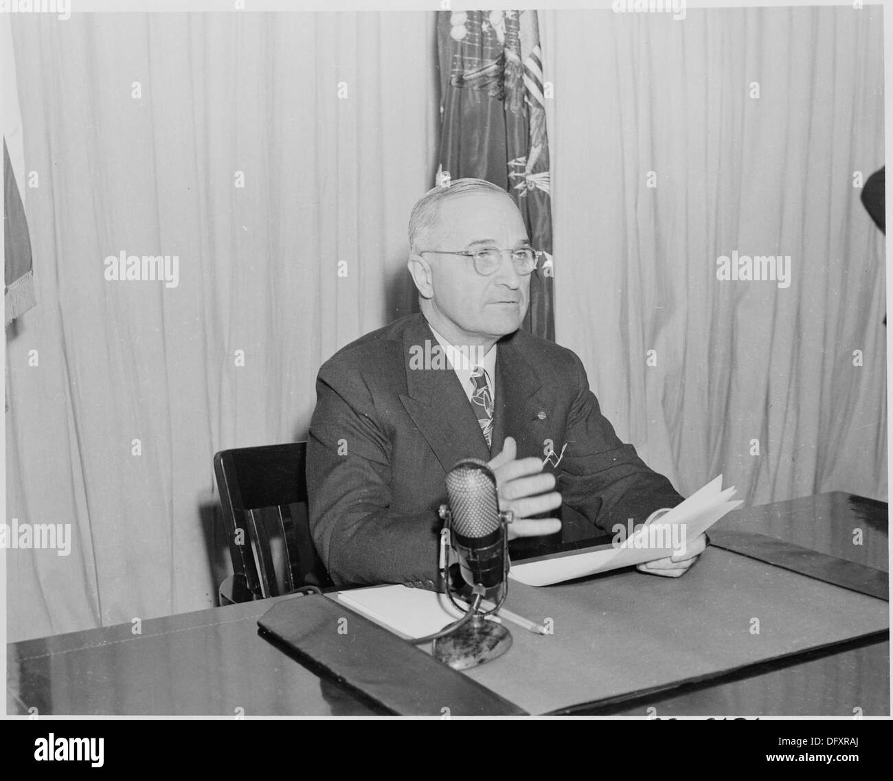Photograph of President Truman delivering his radio speech to the nation on his program for reconversion to a... 199291 Stock Photo