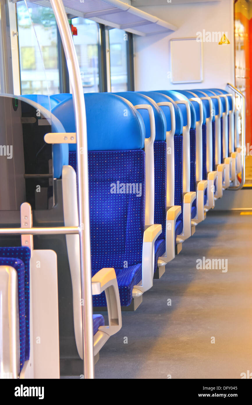 Rows of seats in a passenger train car Stock Photo Alamy