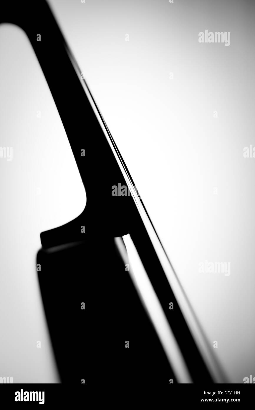 Detail of a violin and bow making music Black and white Abstract