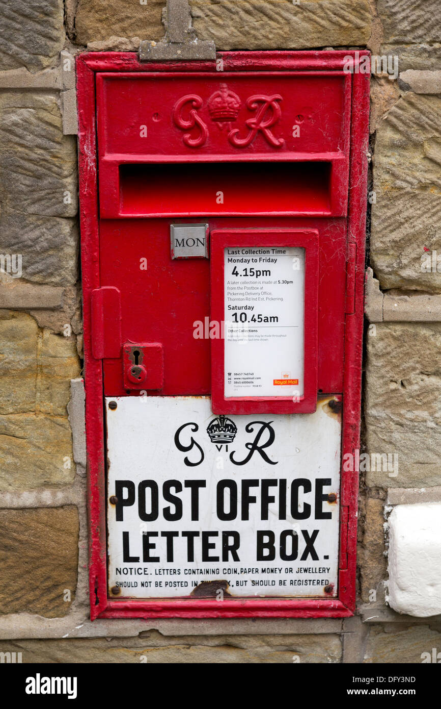 An old red Post Box box in the Village of Rosedale Abbey. Stock Photo