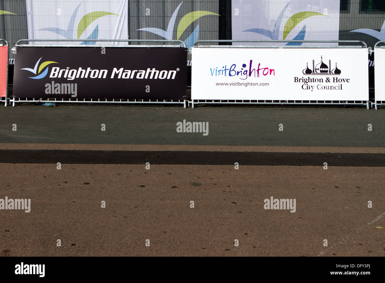 Crowd barrier advertising hoardings at the Brighton Marathon. Stock Photo