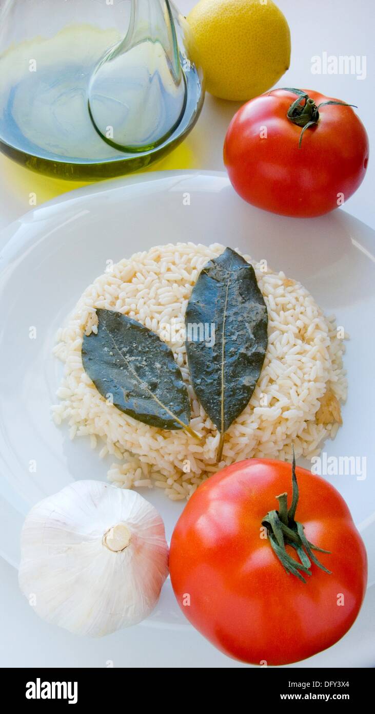Rice, bay leaf and tomato Stock Photo Alamy