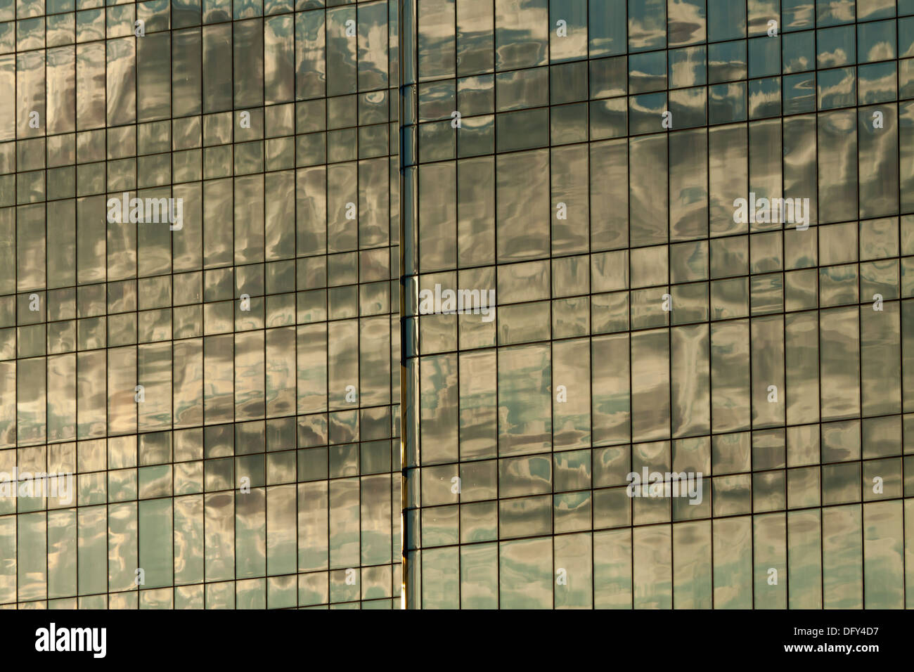 Clouds reflected in windows of modern office building Stock Photo - Alamy