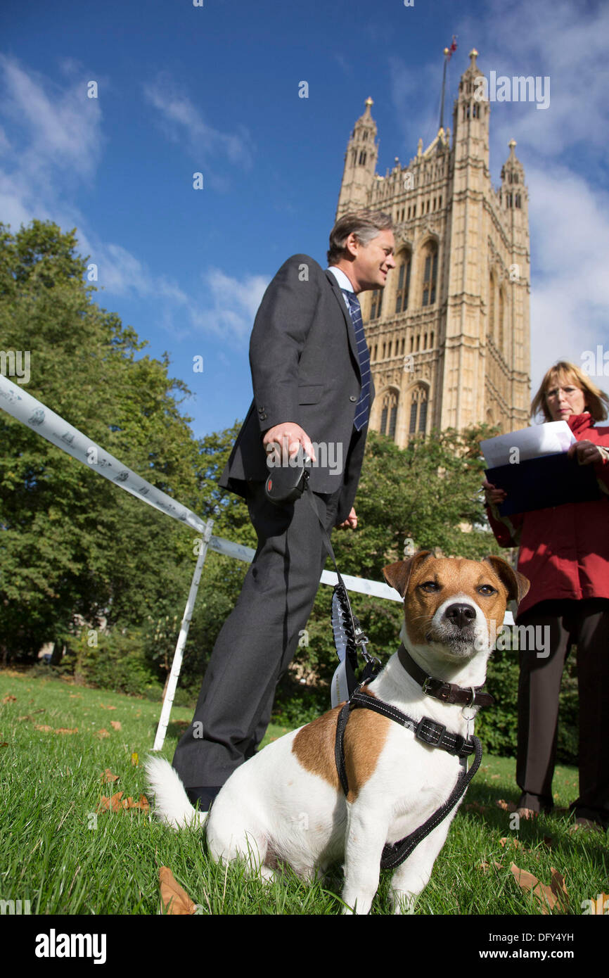 London, UK. Thursday 10th October 2013. Matthew Offord MP with his Jack Russell terrier, Maximus. MPs and their dogs competing in the Westminster Dog of the Year competition celebrates the unique bond between man and dog - and aims to promote responsible dog ownership. Credit:  Michael Kemp/Alamy Live News Stock Photo