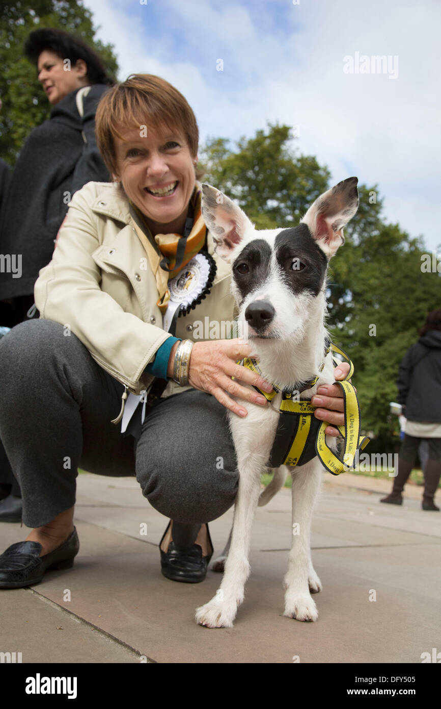 London, UK. Thursday 10th October 2013. Caroline Spelman MP, with a Dogs Trust Recue Dog. MPs and their dogs competing in the Westminster Dog of the Year competition celebrates the unique bond between man and dog - and aims to promote responsible dog ownership. Credit:  Michael Kemp/Alamy Live News Stock Photo