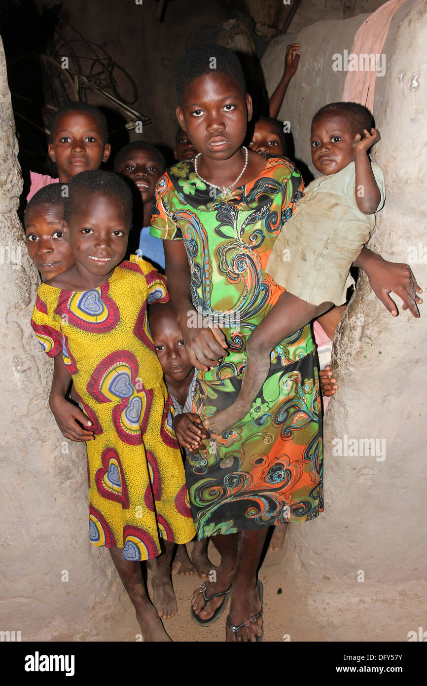 Group Of Lobi Tribe Children Inside A Traditional Village Hut, Ghana Stock Photo