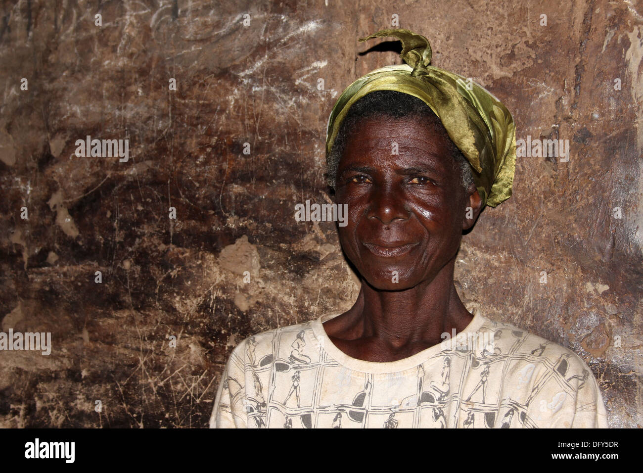 Mature Lobi Woman Inside Her Hut Stock Photo