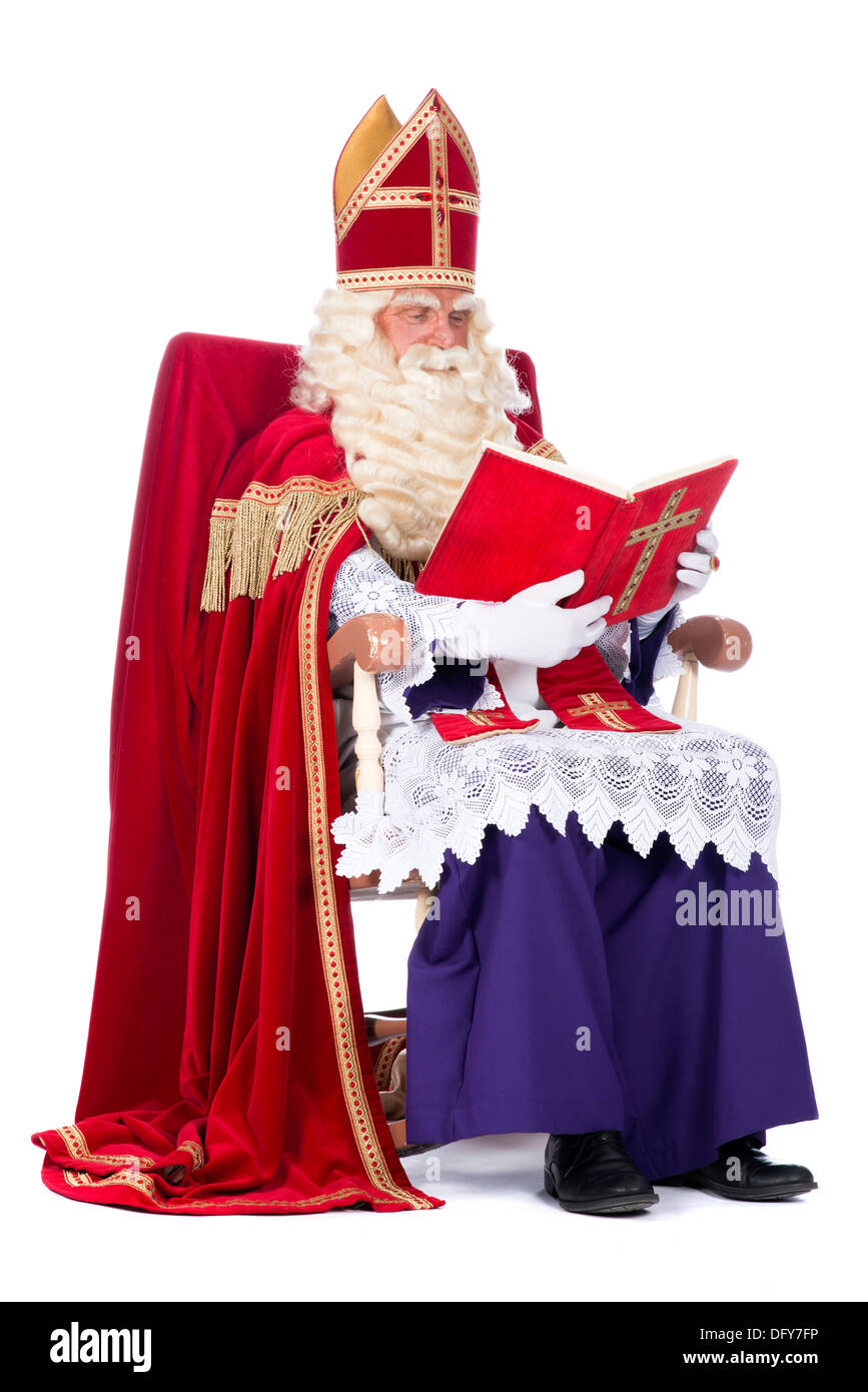 betrouwbaarheid Ananiver Terminologie Sinterklaas is resting on his chair, reading in his book Stock Photo - Alamy