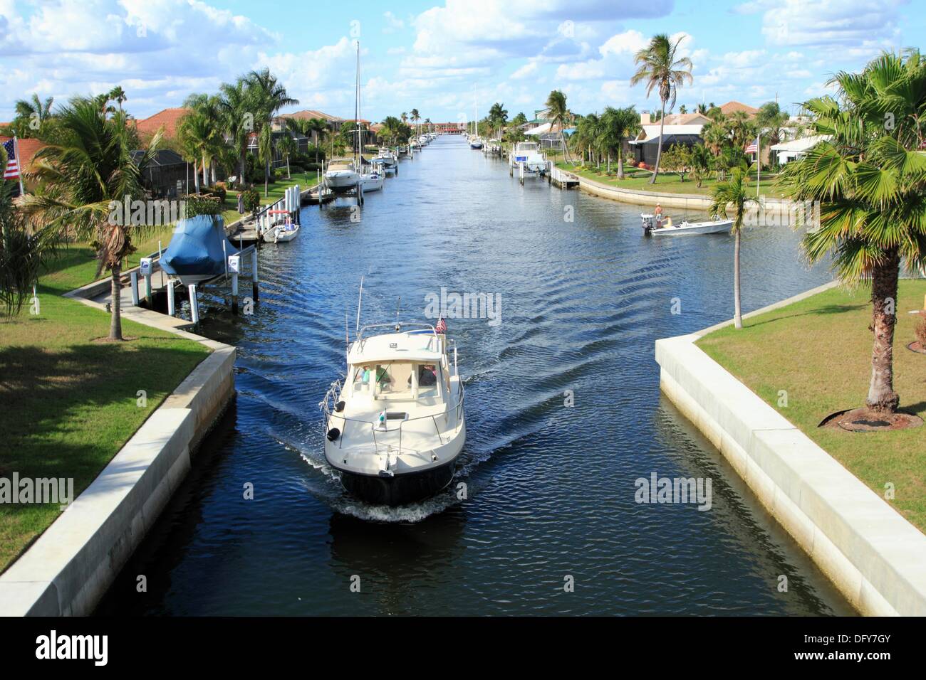 a boat in a canal with waterfront homes in Punta Gorda Florida USA