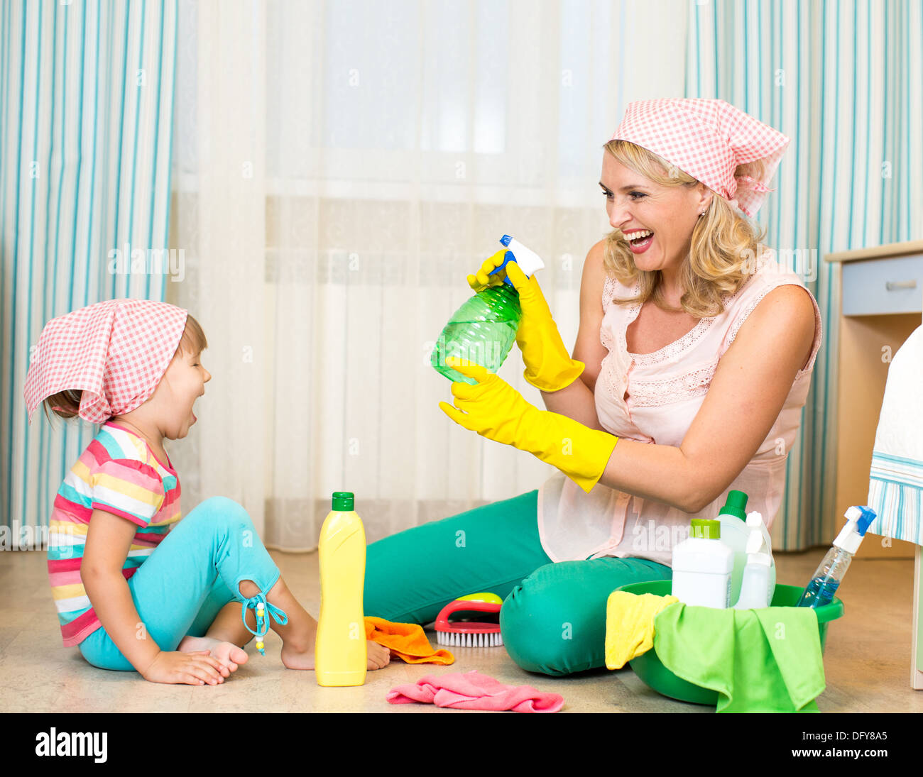 mother with kid cleaning room and having fun Stock Photo