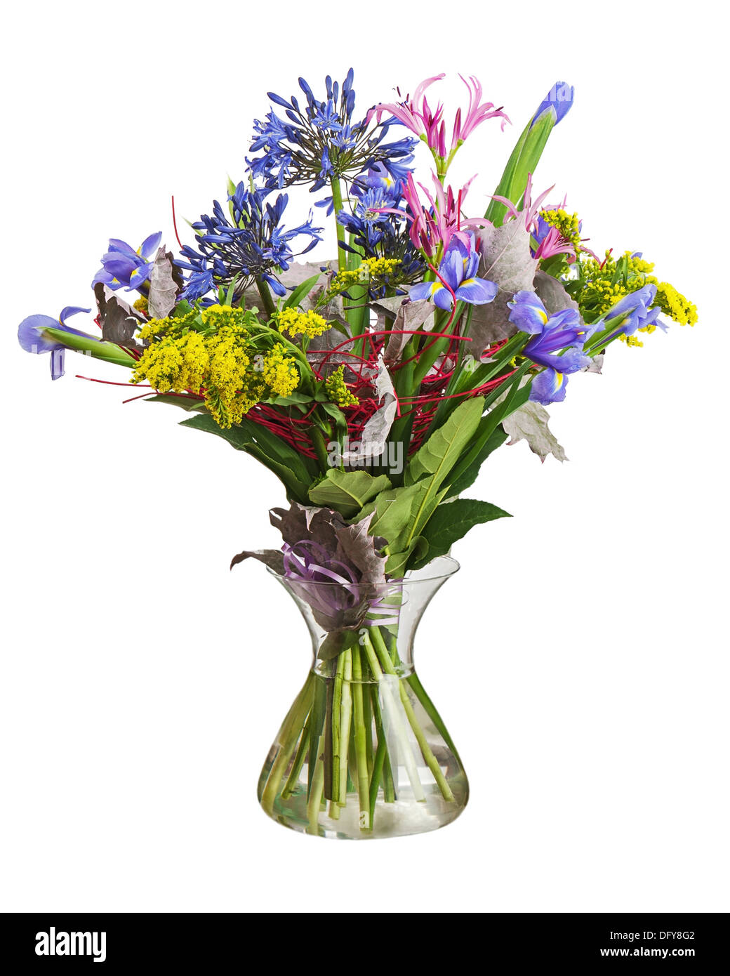 Colorful flower bouquet arrangement centerpiece in vase isolated on white background. Closeup. Stock Photo
