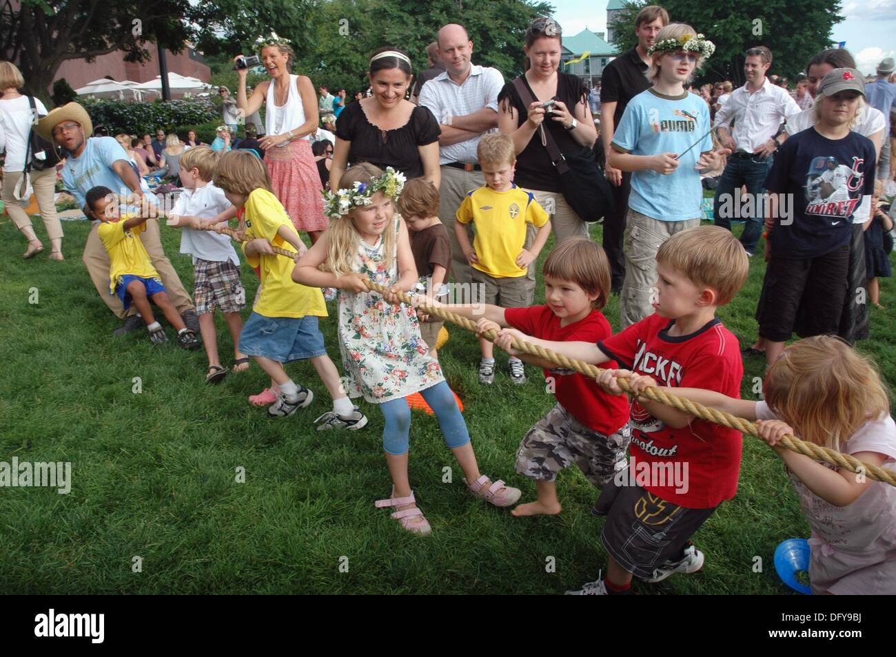 New York City (USA): Swedish-American kids in Battery Park playing at  tug-of-war during the Swedish Midsummer Feast Stock Photo - Alamy