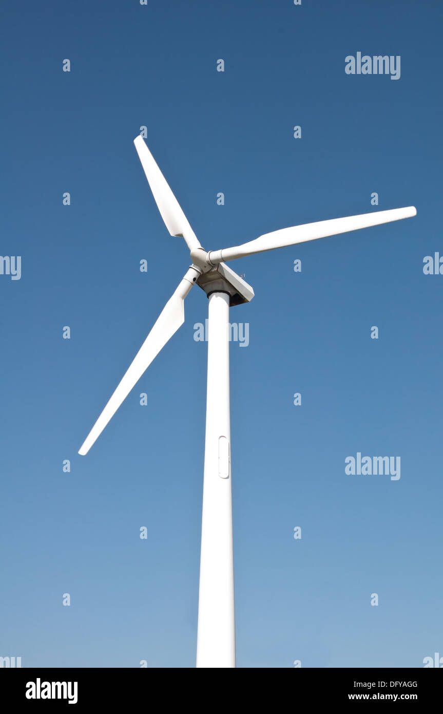 SIngle wind turbine with blue sky background Stock Photo