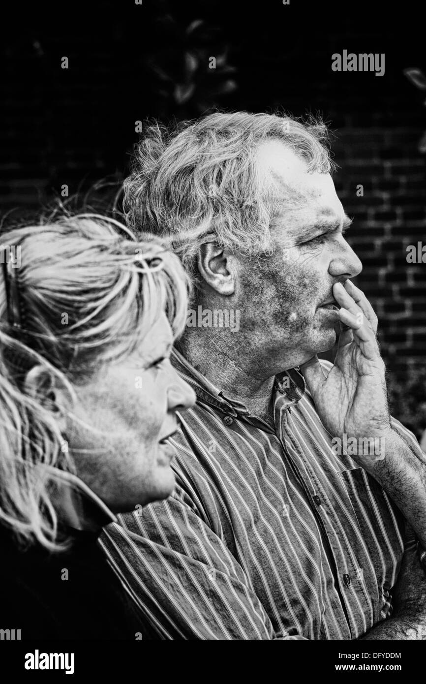 Man and woman looking concerned Stock Photo
