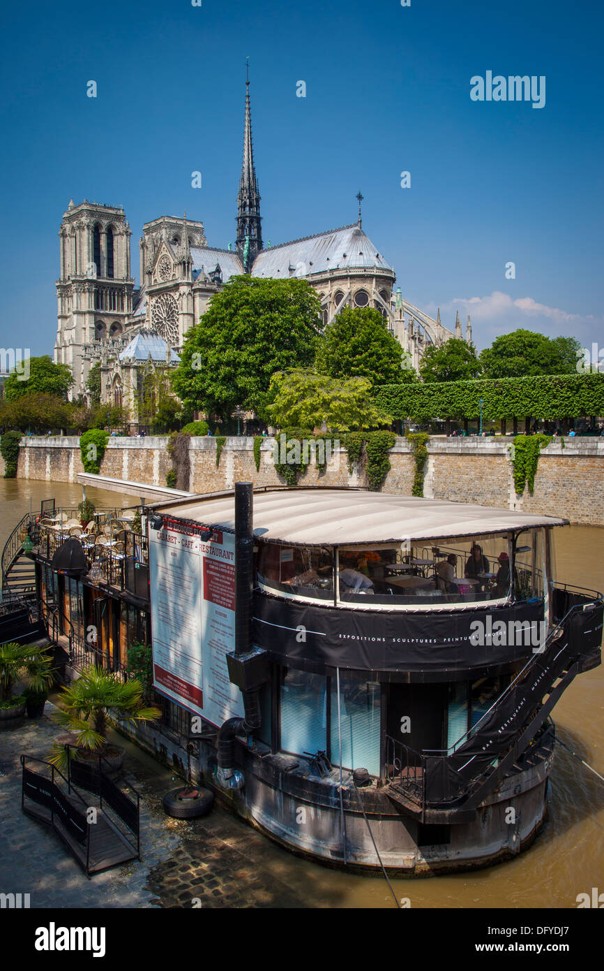 Floating Restaurant and Cafe on River Seine below Cathedral Notre Dame, Paris France Stock Photo