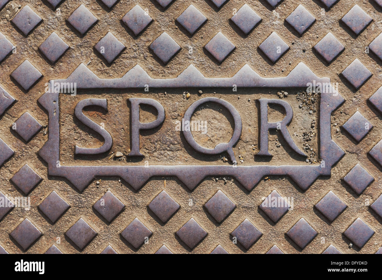 Manhole cover in Rome with the initials SPQR (The Senate and People of Rome), Rome, Lazio, Italy, Europe Stock Photo