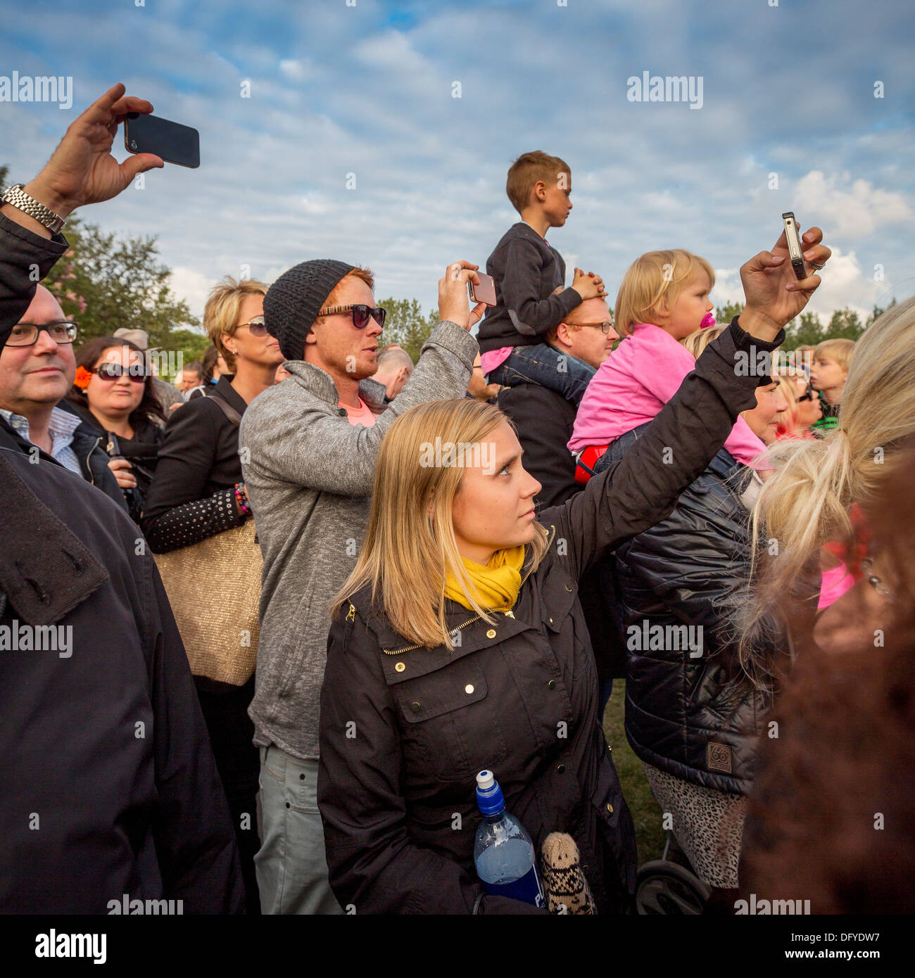 Taking pictures during a concert in the park, 'Of Monsters and Men', Reykjavik, Iceland Stock Photo