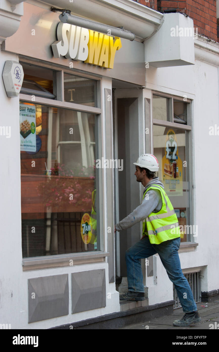 Subway restaurant food outlet, builder entering sandwich shop Stock Photo