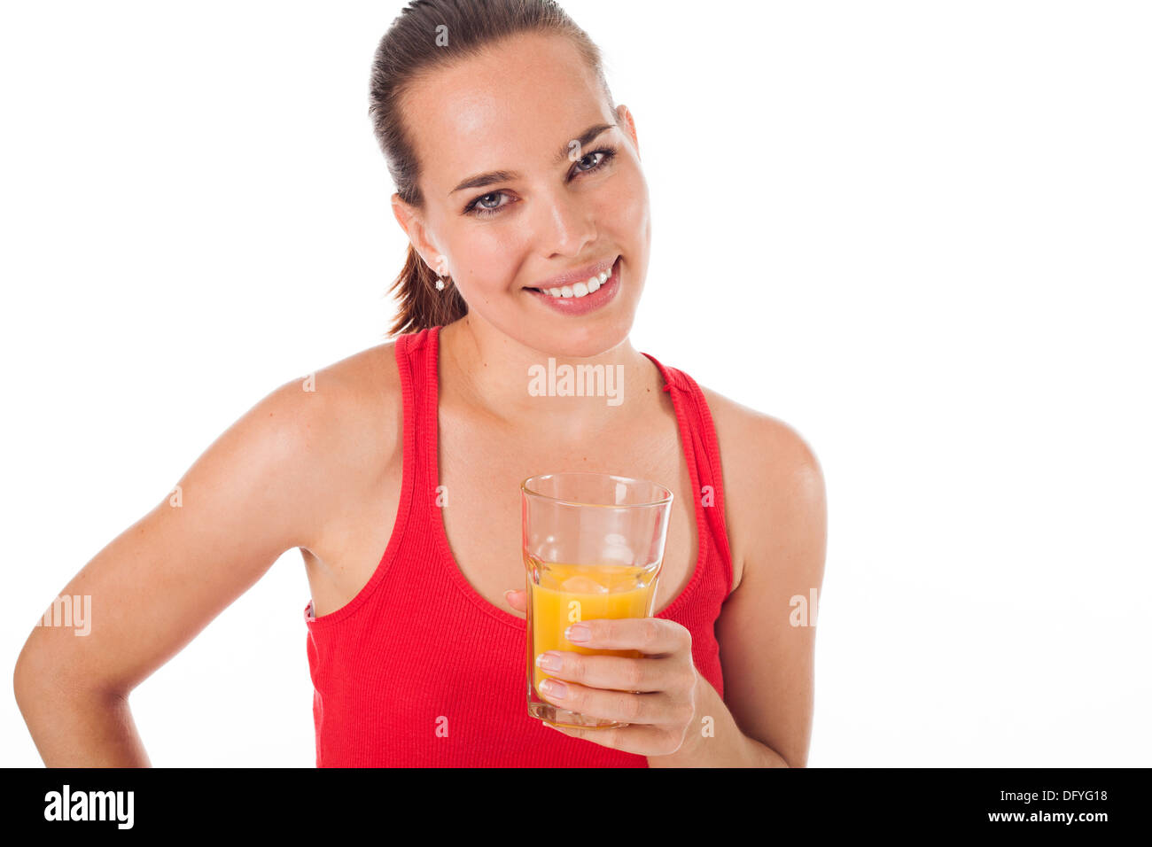 Portrait of a woman drinking an orange juice and smiling, isolated on white Stock Photo Alamy