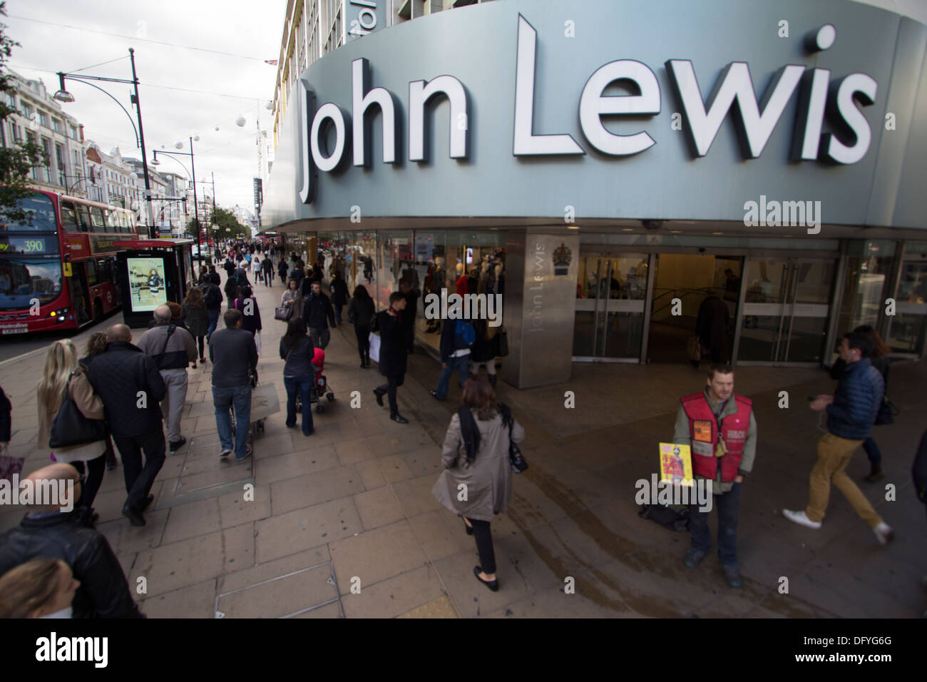 John Lewis Oxford Street London with big issue salesmen in foreground Stock Photo