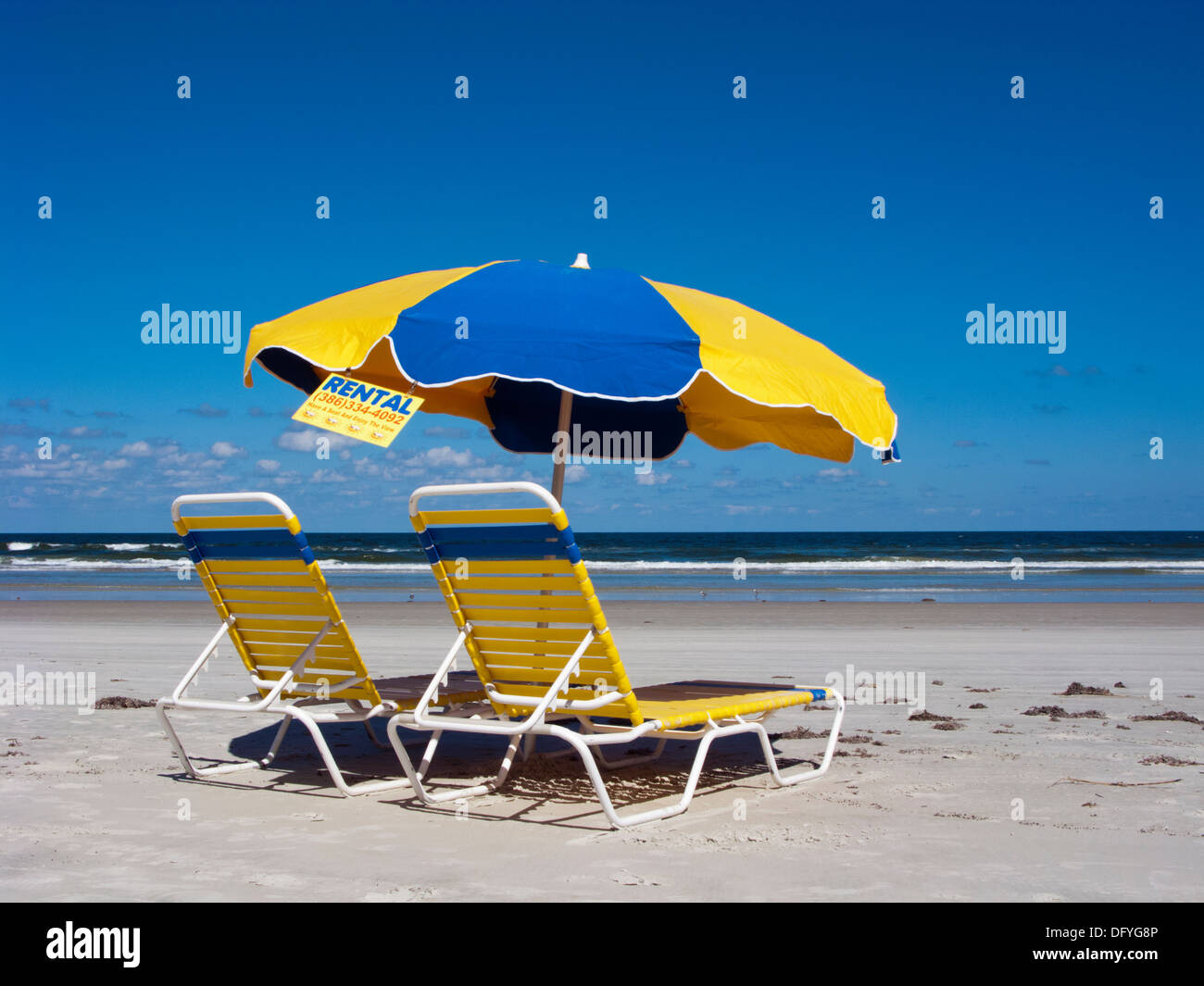 Sunbeds and umbrella for rental in Daytona beach Florida Stock Photo