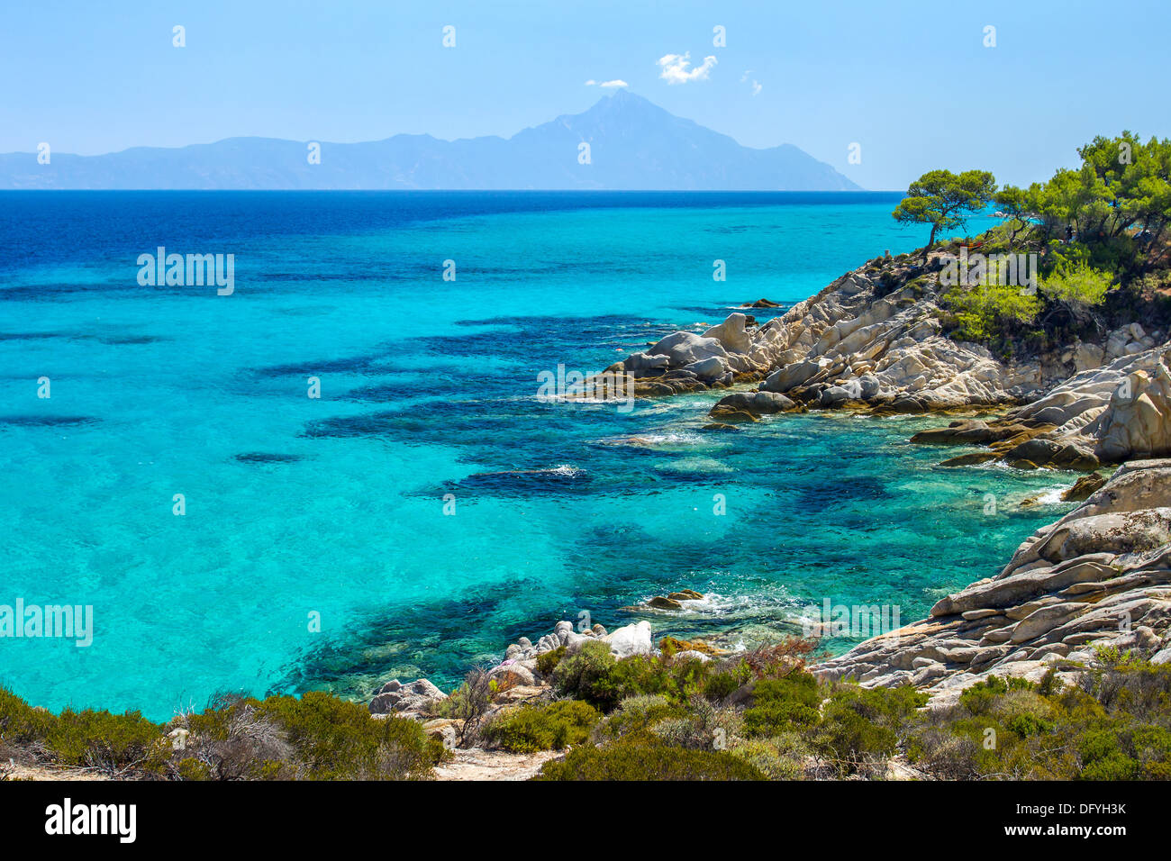 Rocky coastline and a beautiful clear water at Halkidiki Kassandra peninsula in Greece Stock Photo