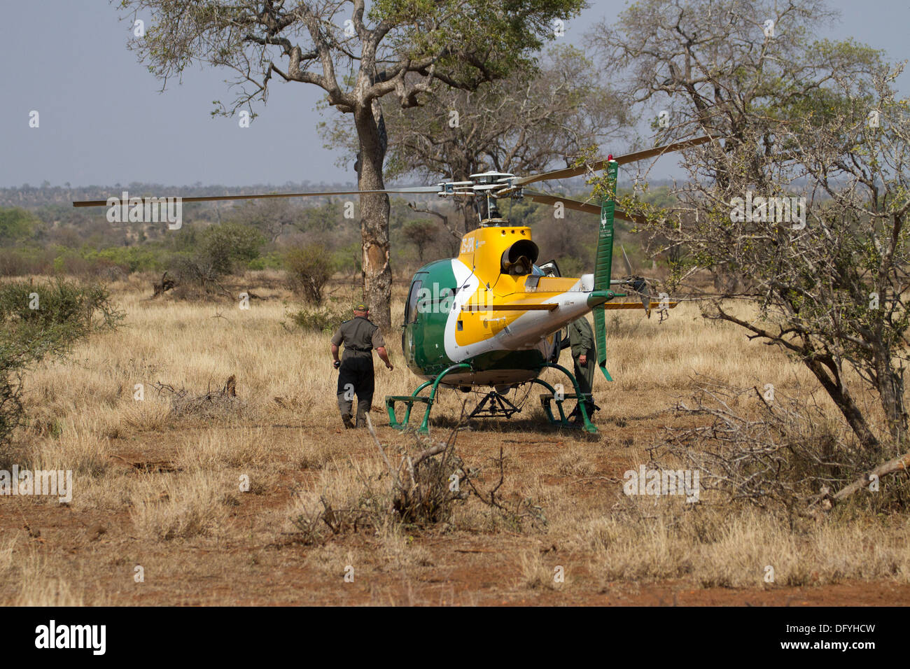 Helicopter and crew of this anti poaching force, Kruger National Park, South Africa. Stock Photo