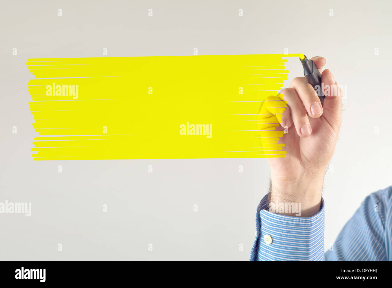 Businessman writing note with yellow marker pen. Copy space for your message. Stock Photo