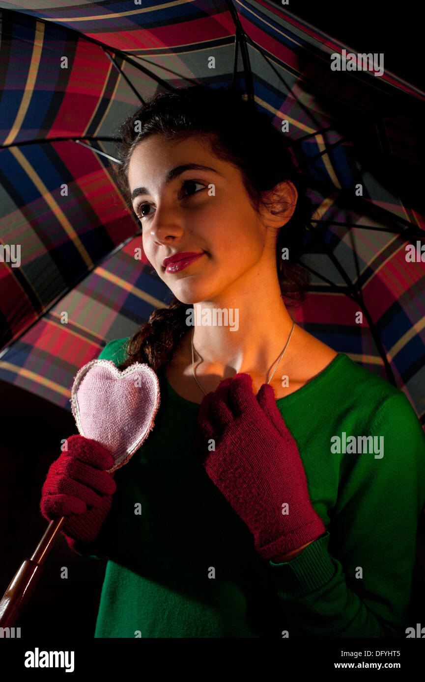 Happy girl holding umbrella hi-res stock photography and images - Alamy