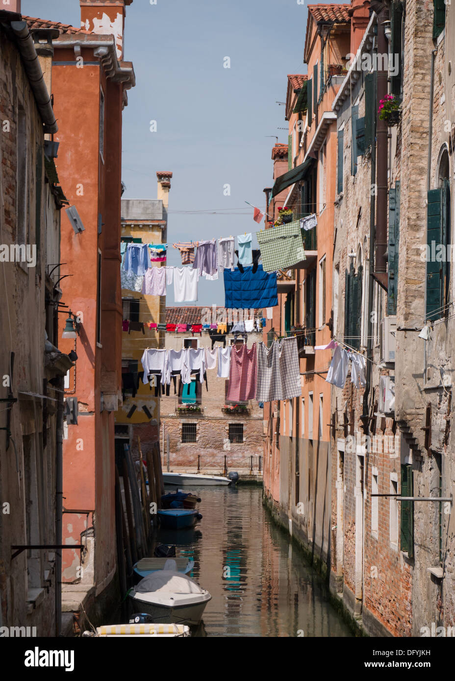 Quiet canal in Venice with wash hanging out to dry Stock Photo