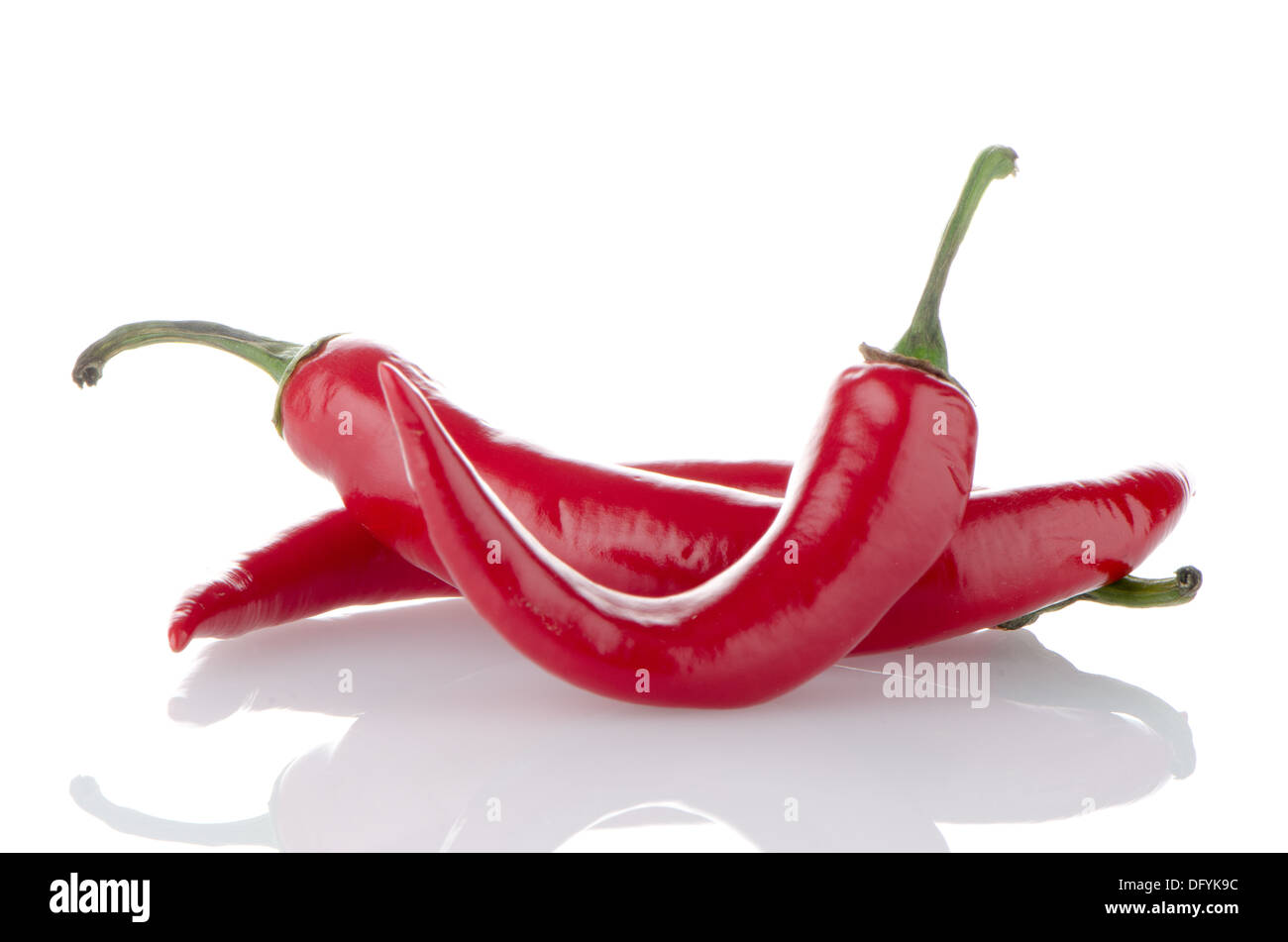Some red hot peppers on a white background Stock Photo - Alamy